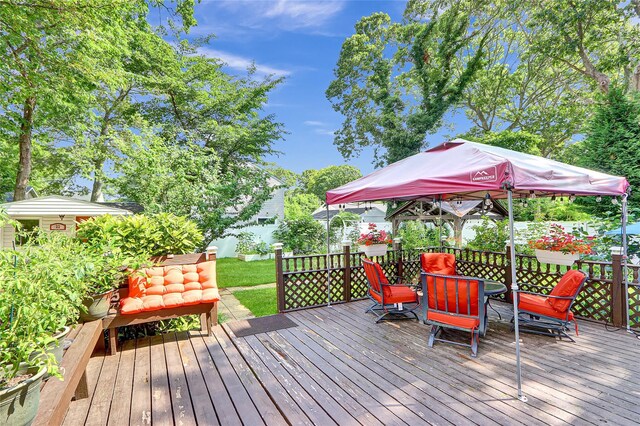 33 Breston Dr W, Shirley, NY 11967 - wooden deck featuring outdoor dining area