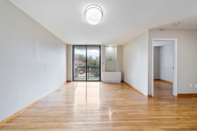 71-24 164th St Unit 2, Fresh Meadows, NY 11365 - unfurnished room with light wood-type flooring and expansive windows