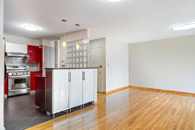 71-24 164th St Unit 2, Fresh Meadows, NY 11365 - kitchen featuring stainless steel gas range, dark countertops, decorative backsplash, and range hood