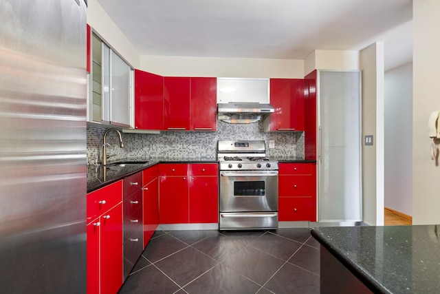 71-24 164th St Unit 2, Fresh Meadows, NY 11365 - kitchen with red cabinets, appliances with stainless steel finishes, tasteful backsplash, and dark tile patterned flooring