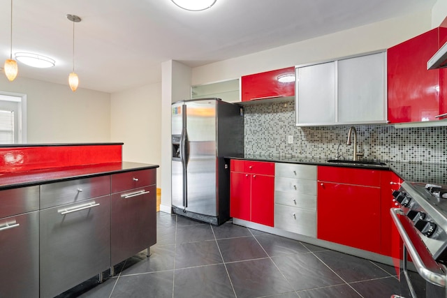 71-24 164th St Unit 2, Fresh Meadows, NY 11365 - kitchen featuring appliances with stainless steel finishes, red cabinetry, tasteful backsplash, dark tile patterned floors, and dark countertops