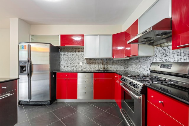 71-24 164th St Unit 2, Fresh Meadows, NY 11365 - kitchen with red cabinetry, stainless steel appliances, exhaust hood, decorative backsplash, and dark tile patterned flooring