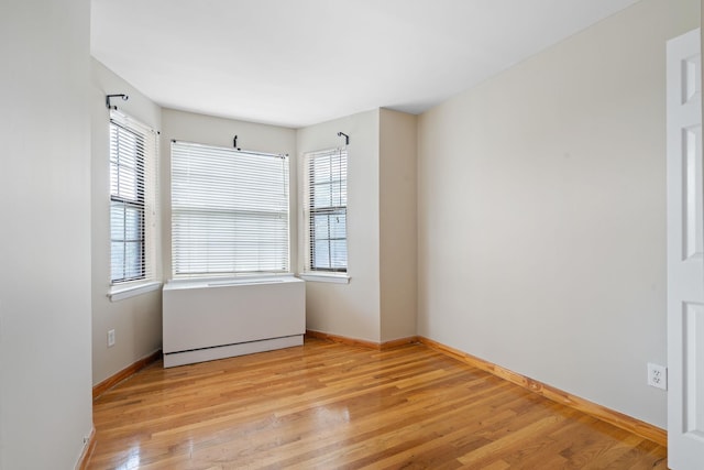 71-24 164th St Unit 2, Fresh Meadows, NY 11365 - spare room featuring wood finished floors and baseboards