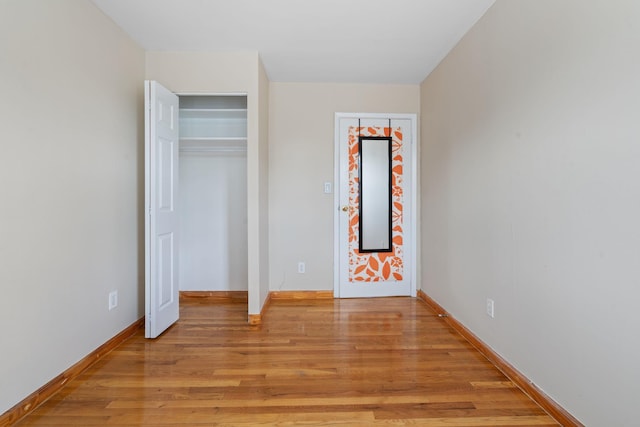 71-24 164th St Unit 2, Fresh Meadows, NY 11365 - unfurnished bedroom featuring light wood finished floors and baseboards
