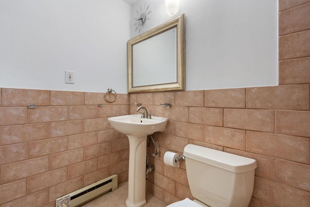 71-24 164th St Unit 2, Fresh Meadows, NY 11365 - half bath featuring a baseboard radiator, tile walls, and a wainscoted wall