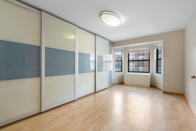 71-24 164th St Unit 2, Fresh Meadows, NY 11365 - unfurnished bedroom featuring light wood-type flooring