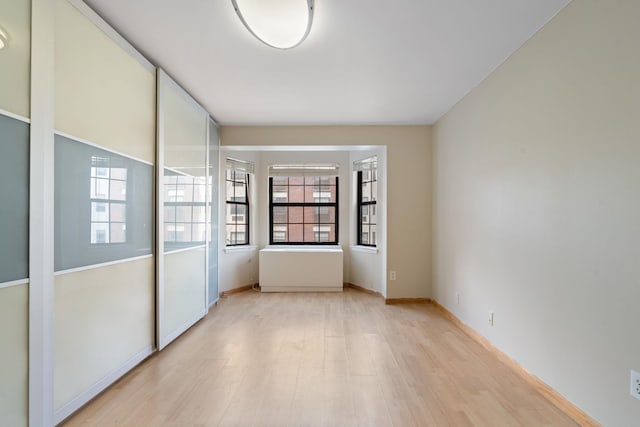 71-24 164th St Unit 2, Fresh Meadows, NY 11365 - spare room with light wood-style floors and baseboards