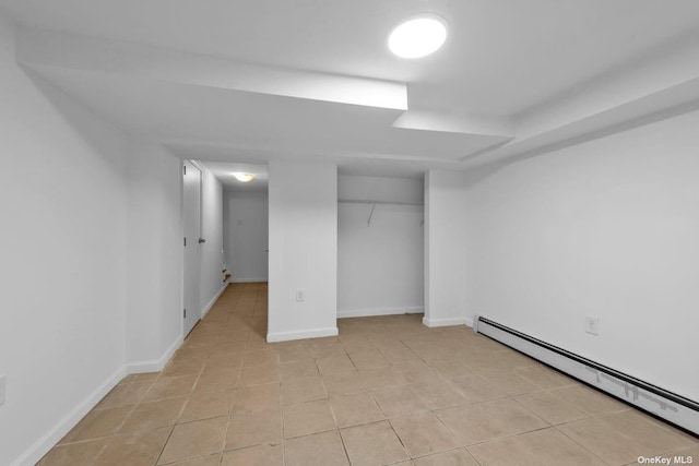 20-12 120th St, College Point, NY 11356 - unfurnished bedroom featuring baseboard heating, a closet, and light tile patterned floors