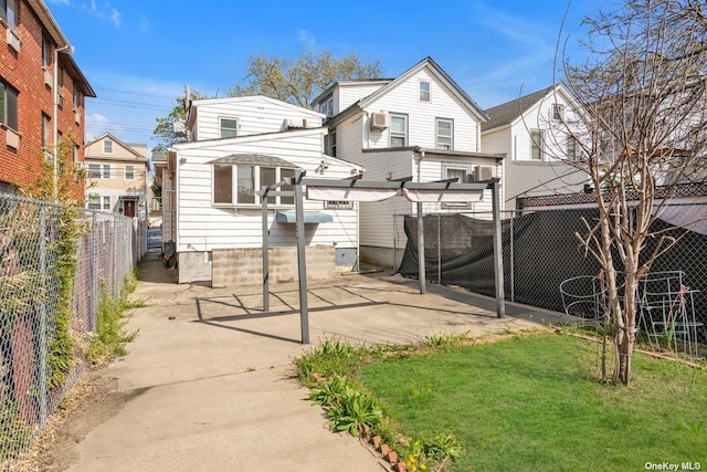 20-12 120th St, College Point, NY 11356 - rear view of house featuring a fenced backyard and a patio area