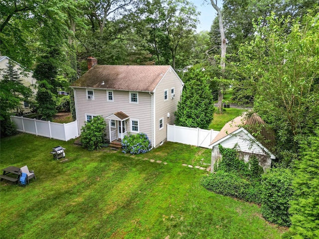 12 Greentree Ct, Northport, NY 11768 - back of property with a chimney, a fenced backyard, and a gate