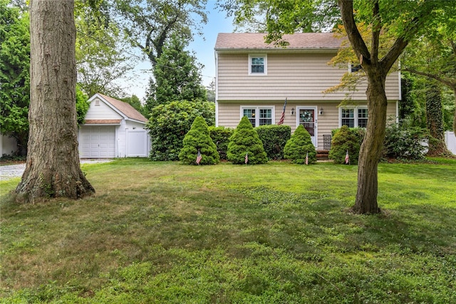 12 Greentree Ct, Northport, NY 11768 - colonial house featuring a front yard and a detached garage