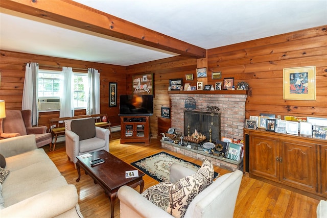 12 Greentree Ct, Northport, NY 11768 - living room featuring beam ceiling, light wood-style floors, a brick fireplace, cooling unit, and wooden walls