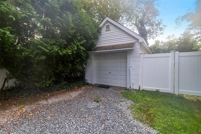 12 Greentree Ct, Northport, NY 11768 - detached garage featuring gravel driveway