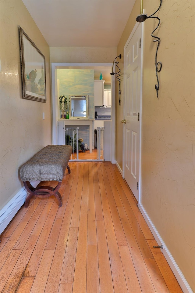 22 Indian Ave, Flanders, NY 11901 - hallway with light wood-style flooring and baseboards