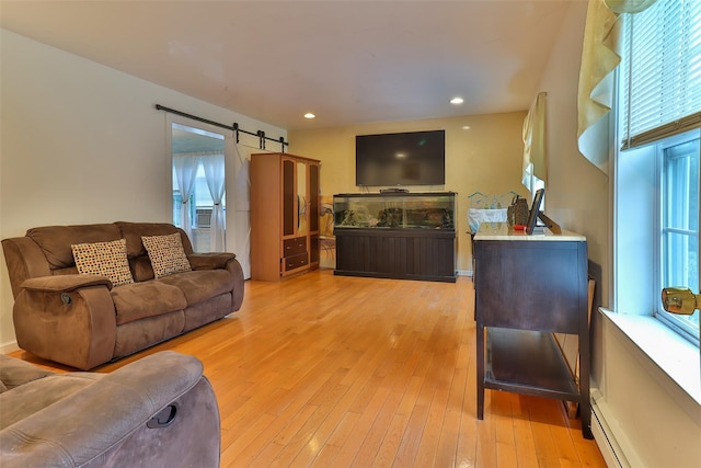 22 Indian Ave, Flanders, NY 11901 - living area with a barn door, light wood-style floors, a baseboard radiator, and recessed lighting
