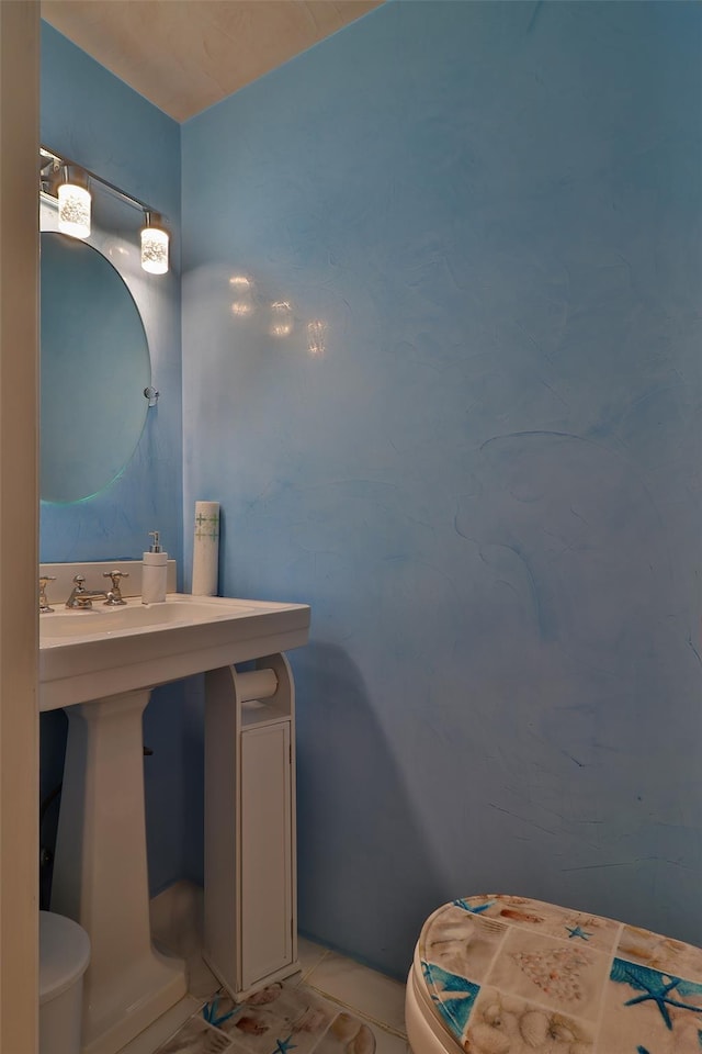 22 Indian Ave, Flanders, NY 11901 - half bathroom with toilet and tile patterned flooring