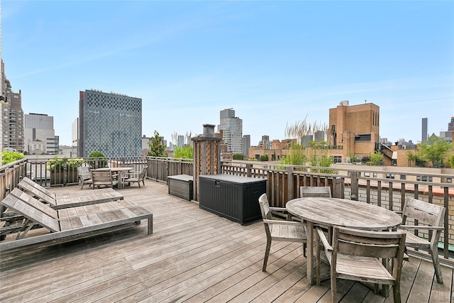 301 E 69th St Unit 4C, New York Manhattan, NY 10021 - wooden terrace with outdoor dining space and a skyline view