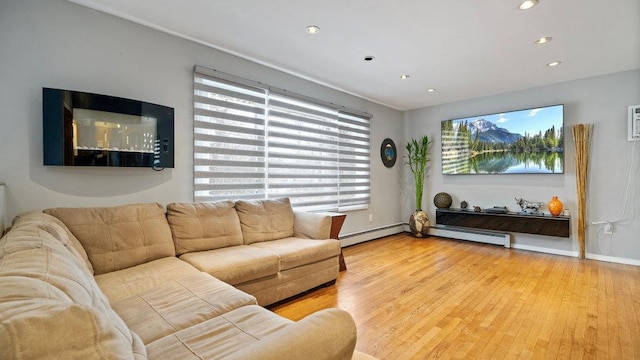 95 Foster Ave, Valley Stream, NY 11580 - living room with wood finished floors, recessed lighting, and a baseboard heating unit