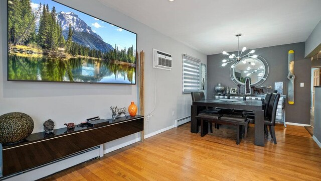 95 Foster Ave, Valley Stream, NY 11580 - dining room featuring a baseboard radiator, a wall unit AC, a chandelier, and light wood-type flooring