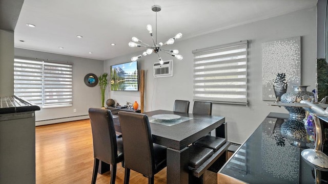 95 Foster Ave, Valley Stream, NY 11580 - dining area with a baseboard radiator, a chandelier, plenty of natural light, light wood finished floors, and recessed lighting