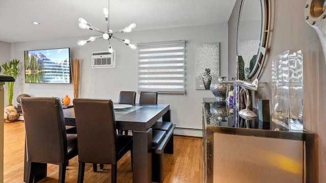 95 Foster Ave, Valley Stream, NY 11580 - dining room featuring a chandelier, wood finished floors, and a baseboard heating unit