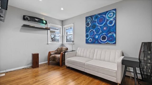 95 Foster Ave, Valley Stream, NY 11580 - living area featuring wood finished floors, recessed lighting, and a baseboard radiator