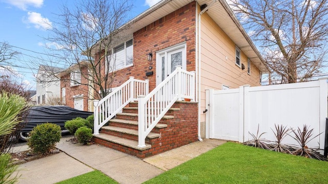 95 Foster Ave, Valley Stream, NY 11580 - view of exterior entry with a gate