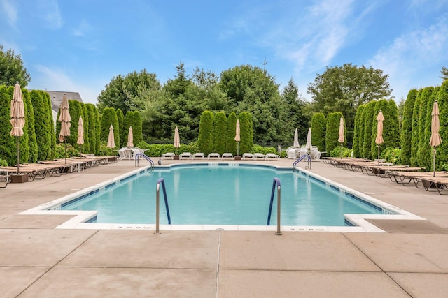 109 Louden Loop, Mount Sinai, NY 11766 - community pool featuring a patio area and view of wooded area