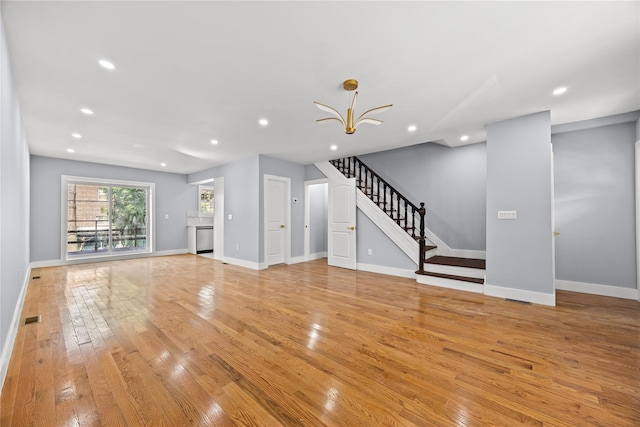 24-08 97th St, East Elmhurst, NY 11369 - unfurnished living room featuring stairs, light wood-style floors, recessed lighting, and a chandelier