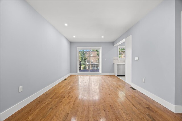 24-08 97th St, East Elmhurst, NY 11369 - unfurnished living room featuring light wood-style floors and recessed lighting