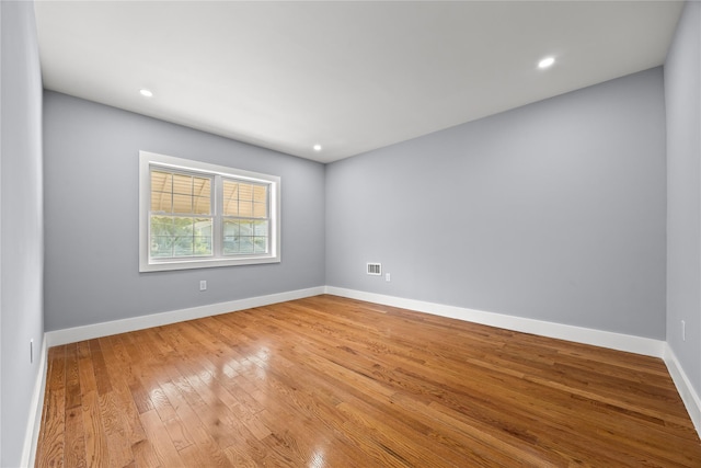 24-08 97th St, East Elmhurst, NY 11369 - unfurnished room with hardwood / wood-style flooring and recessed lighting