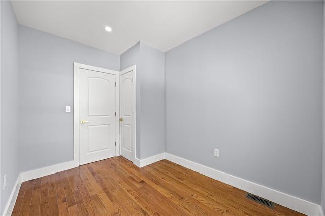 24-08 97th St, East Elmhurst, NY 11369 - empty room featuring wood finished floors and recessed lighting