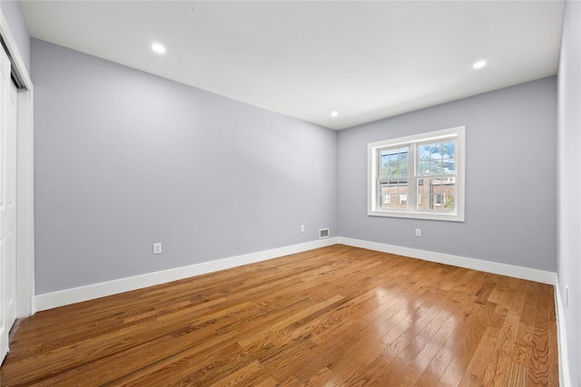 24-08 97th St, East Elmhurst, NY 11369 - unfurnished room with wood finished floors and recessed lighting