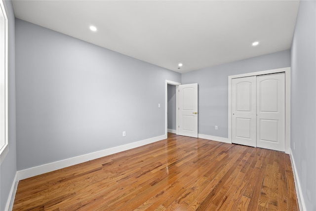 24-08 97th St, East Elmhurst, NY 11369 - unfurnished bedroom with wood finished floors, a closet, and recessed lighting