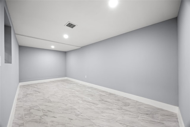 24-08 97th St, East Elmhurst, NY 11369 - unfurnished room with marble look tile flooring and recessed lighting