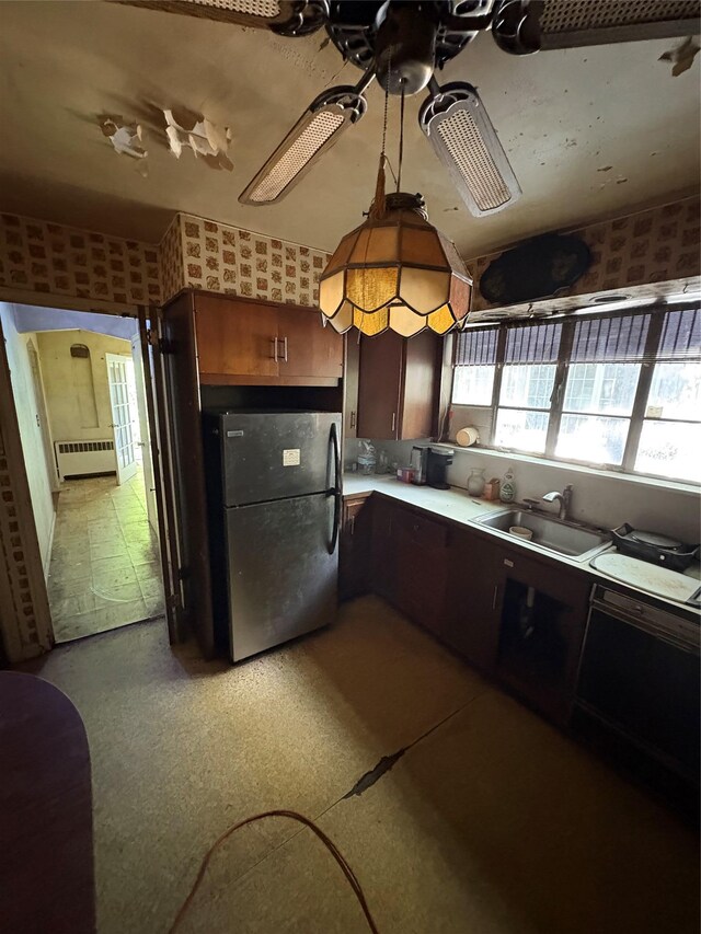 425 W 256th St, Bronx, NY 10471 - kitchen featuring freestanding refrigerator, radiator heating unit, wallpapered walls, light countertops, and a ceiling fan