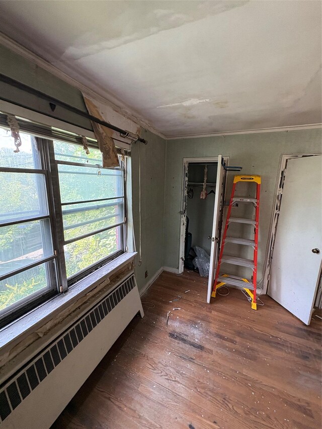 425 W 256th St, Bronx, NY 10471 - unfurnished room with radiator heating unit and hardwood / wood-style flooring