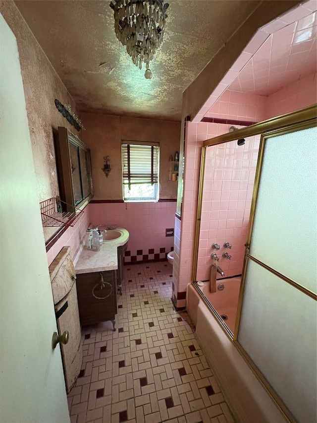 425 W 256th St, Bronx, NY 10471 - full bathroom featuring vanity, enclosed tub / shower combo, and a wainscoted wall