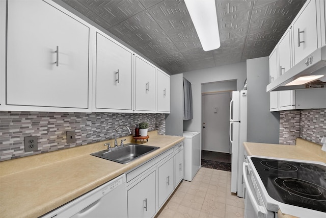 17 Village Park Dr Unit 3A, Fishkill, NY 12524 - kitchen with white appliances, washer / dryer, light countertops, white cabinetry, and an ornate ceiling