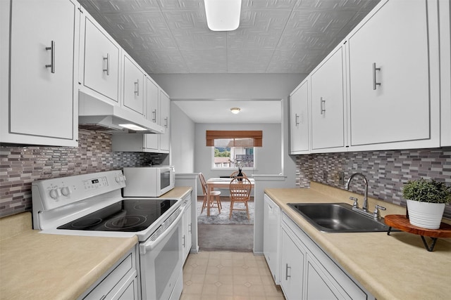 17 Village Park Dr Unit 3A, Fishkill, NY 12524 - kitchen featuring white appliances, under cabinet range hood, white cabinetry, light countertops, and backsplash