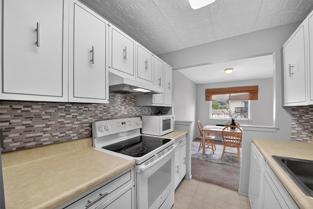 17 Village Park Dr Unit 3A, Fishkill, NY 12524 - kitchen featuring white appliances, under cabinet range hood, light countertops, and white cabinetry