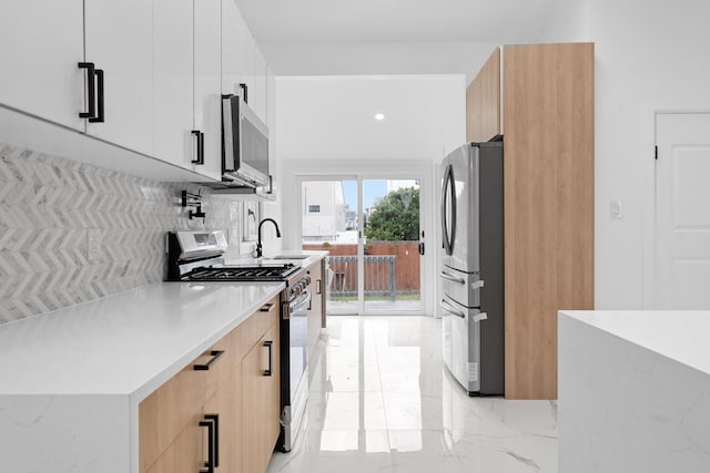 2572 Riverside Ave, Seaford, NY 11783 - kitchen featuring stainless steel appliances, modern cabinets, light marble finish floors, and backsplash