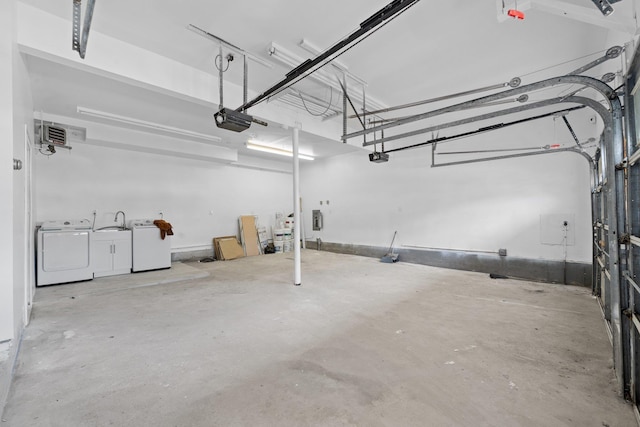 2572 Riverside Ave, Seaford, NY 11783 - garage with washing machine and dryer and a garage door opener