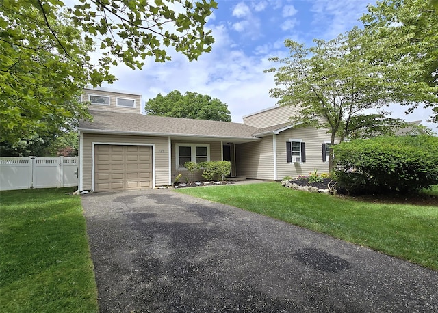 2189 Cedar Ave, Ronkonkoma, NY 11779 - view of front facade featuring a garage, driveway, and a shingled roof