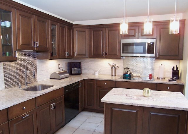 2189 Cedar Ave, Ronkonkoma, NY 11779 - kitchen with black appliances, dark brown cabinets, and pendant lighting
