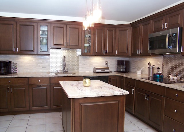 2189 Cedar Ave, Ronkonkoma, NY 11779 - kitchen with black appliances, light tile patterned flooring, pendant lighting, backsplash, and light stone counters
