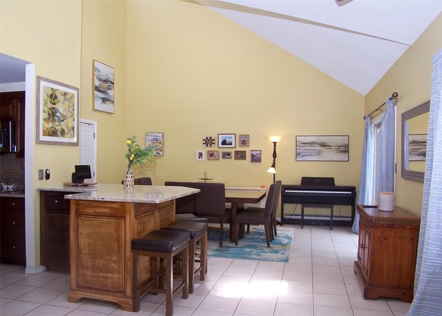 2189 Cedar Ave, Ronkonkoma, NY 11779 - bar area featuring high vaulted ceiling and light tile patterned floors