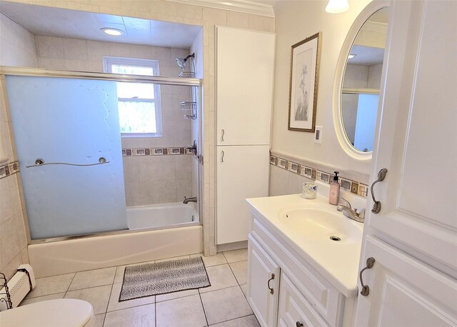2189 Cedar Ave, Ronkonkoma, NY 11779 - bathroom with tile patterned flooring, tile walls, vanity, and shower / washtub combination