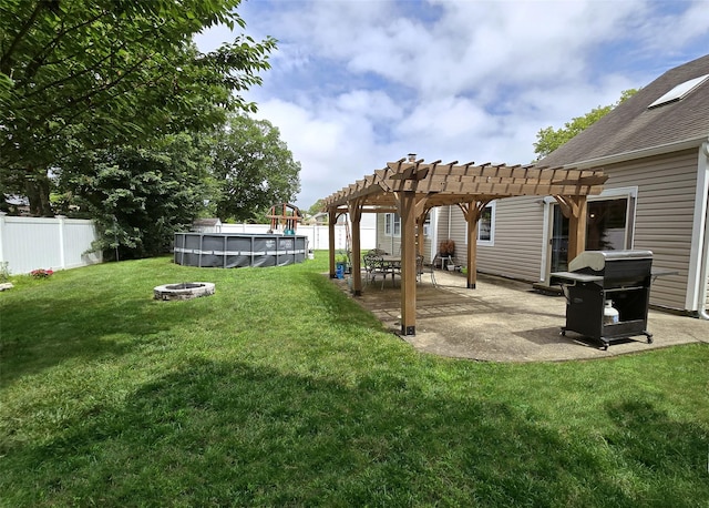 2189 Cedar Ave, Ronkonkoma, NY 11779 - view of yard with a pergola, a patio area, and an outdoor fire pit