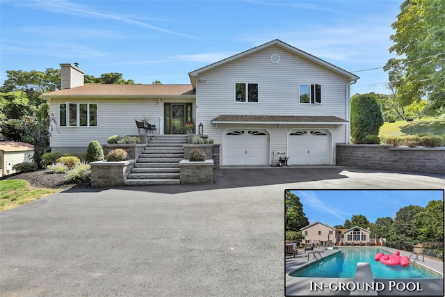 35 Lattintown Rd, Newburgh, NY 12550 - view of front of home with an attached garage, asphalt driveway, a chimney, an outdoor pool, and roof with shingles